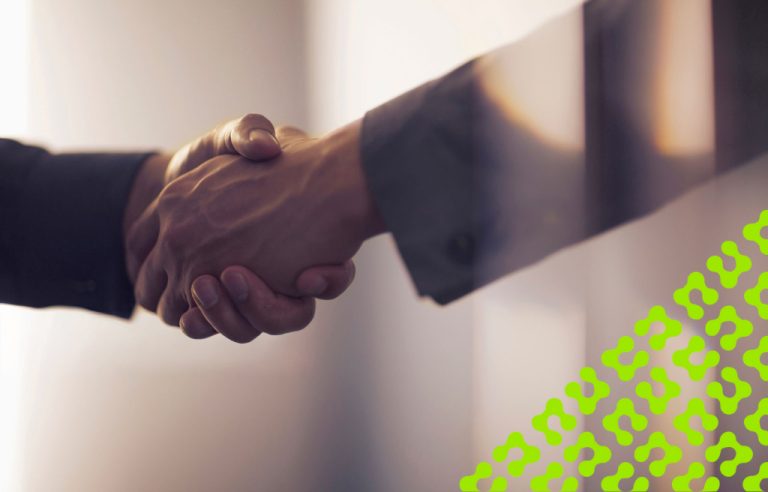 Handshake between two people dressed in business attire